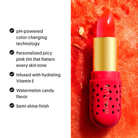 Winky Lux tube in a sunny summer setting evoking watermelon scent and mood boost