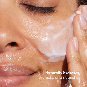 Womaness Clean Slate cream texture close-up showing rich hydration and gentle feel