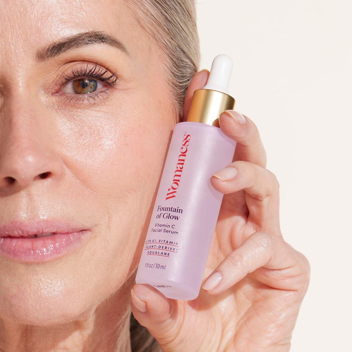 Womaness texture close-up drop highlighting lightweight, dewy finish