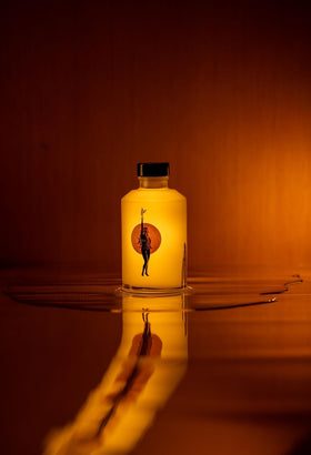 WONDER VALLEY bottle next to everyday objects showing 200 ml scale for size clarity