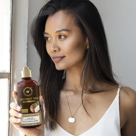 WOW Skin Science bottle in hand to show 16.9 oz scale and travel-friendly benefit