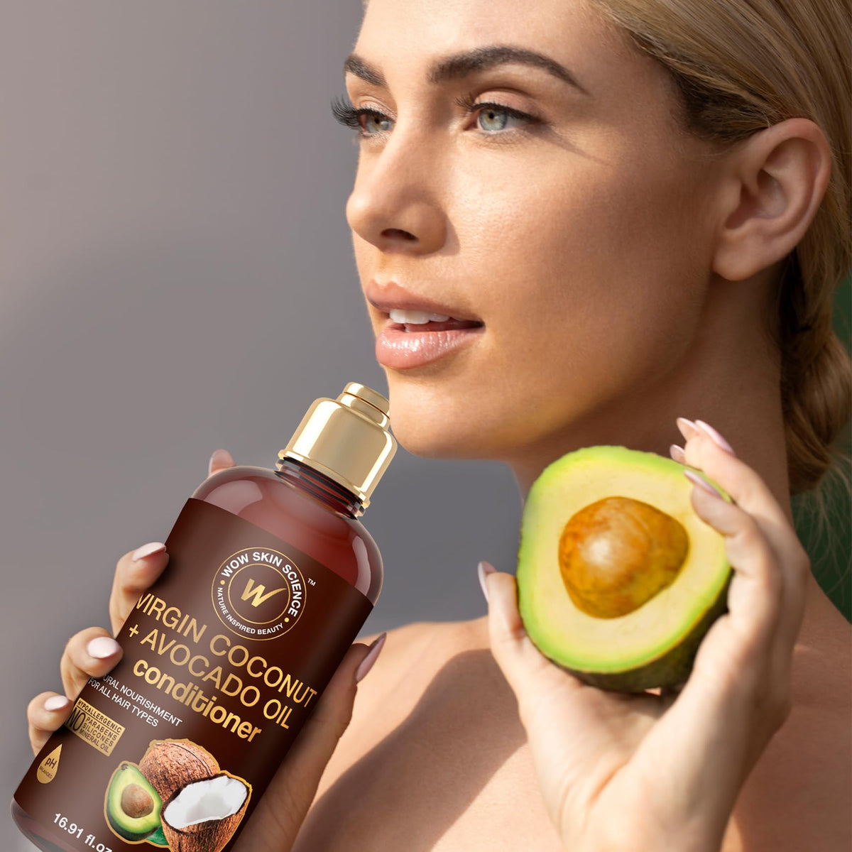 WOW Life Science applying conditioner to wet hair to reduce frizz