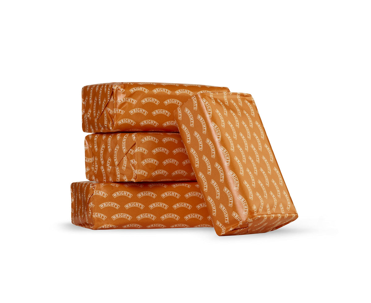 Wright's soap bar close-up highlighting coal tar texture and lather for visible cleansing action