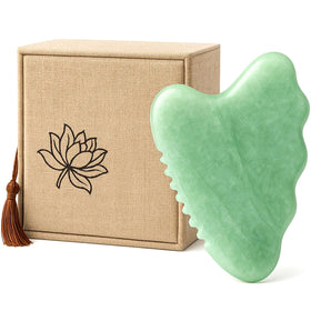 WYGOAKG front view of jade gua sha showing shape and comb edge for sculpting