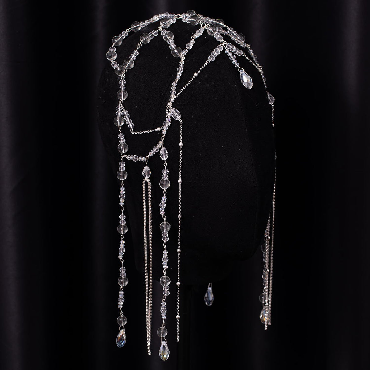 Xerling headpiece held in hand to show scale and easy travel-friendly size