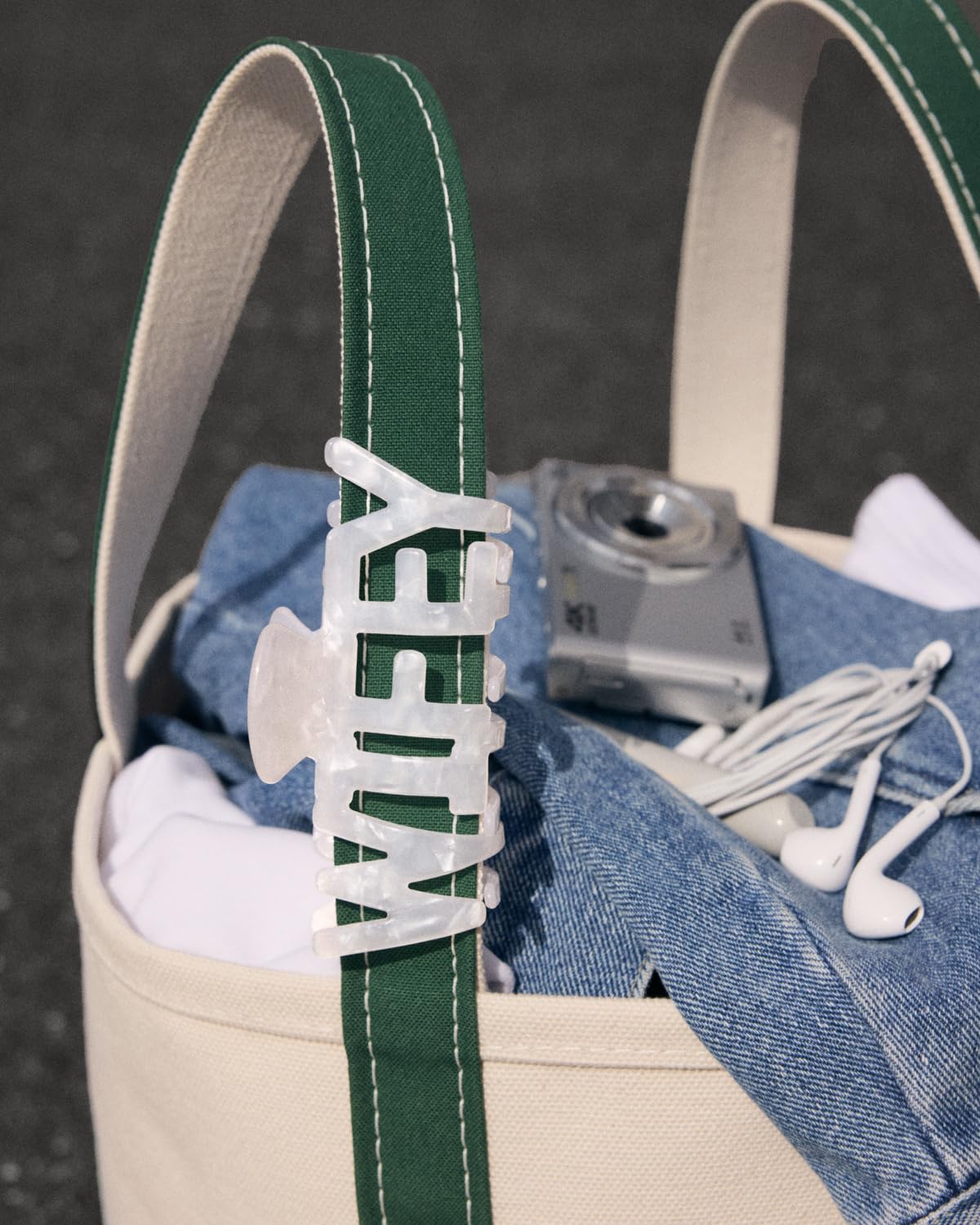 xo, Fetti close-up of glossy white acrylic texture showing reflective finish and photo-ready shine