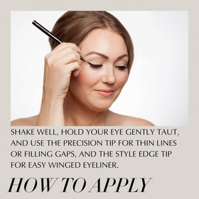 Xtreme Lashes pen beside fingers showing portable size and ease