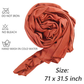 XTREND model wearing a turban-style wrap demonstrating secure comfortable fit