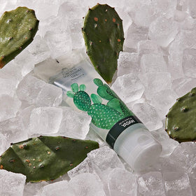 YADAH bottle next to a hand for size and travel-friendly scale