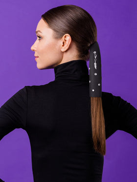 Yinkin worn under a motorcycle helmet showing secure hair hold while riding