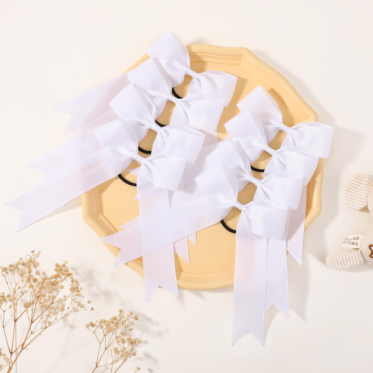 YLEN YHXX bow next to ruler showing 5.3 inch size for visible style