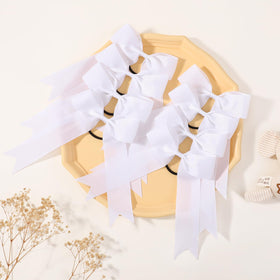 YLEN YHXX bow next to ruler showing 5.3 inch size for visible style