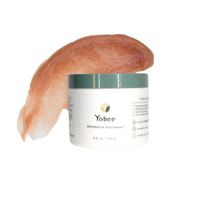 Yobee jar held in hand showing 4 fl oz scale and travel-friendly benefit
