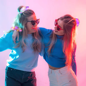 Yomwig scrunchie in ponytail at a club showing vibrant light for standout party looks