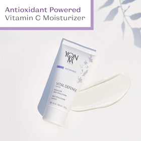Woman applying cream before heading outdoors, Yonka defends against pollution