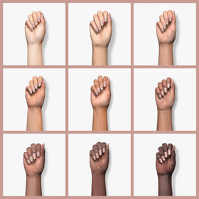 Young Nails powder applied to nail tip illustrating smooth build and natural pink base