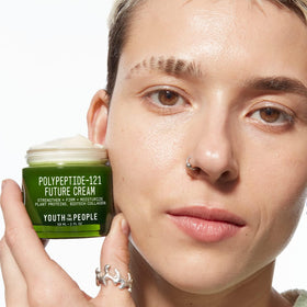 Youth To The People cream on hand illustrating smooth application and absorption