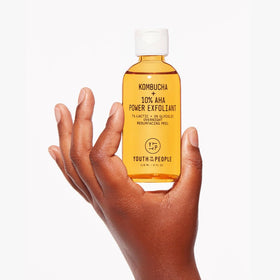Youth To The People product staged with kombucha and greens highlighting superfoods