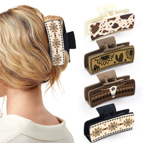 Yussti front view of four western claw clips showing designs and gift-ready packaging