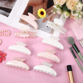 Yuxung clips styled on nightstand in bedroom highlighting pretty translucent colors for outfits
