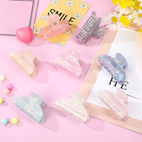 Yuxung clips worn in outdoor casual hairstyle adding stylish colorful accent