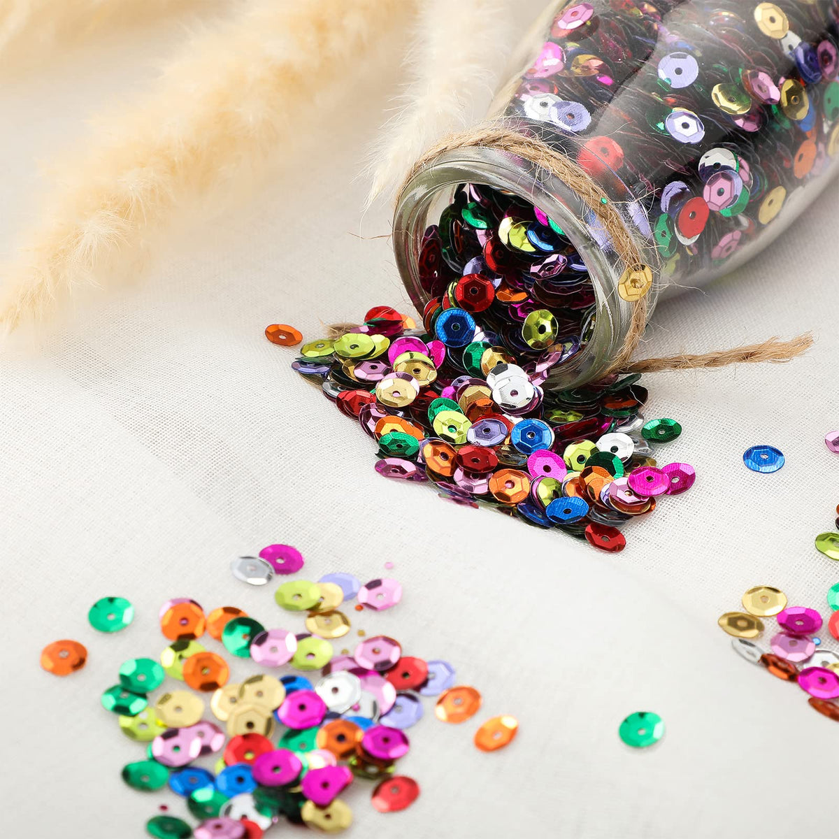 Yuxung sequins held in hand to show 6mm scale and easy handling benefit