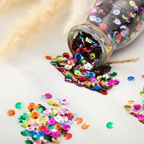 Yuxung sequins held in hand to show 6mm scale and easy handling benefit