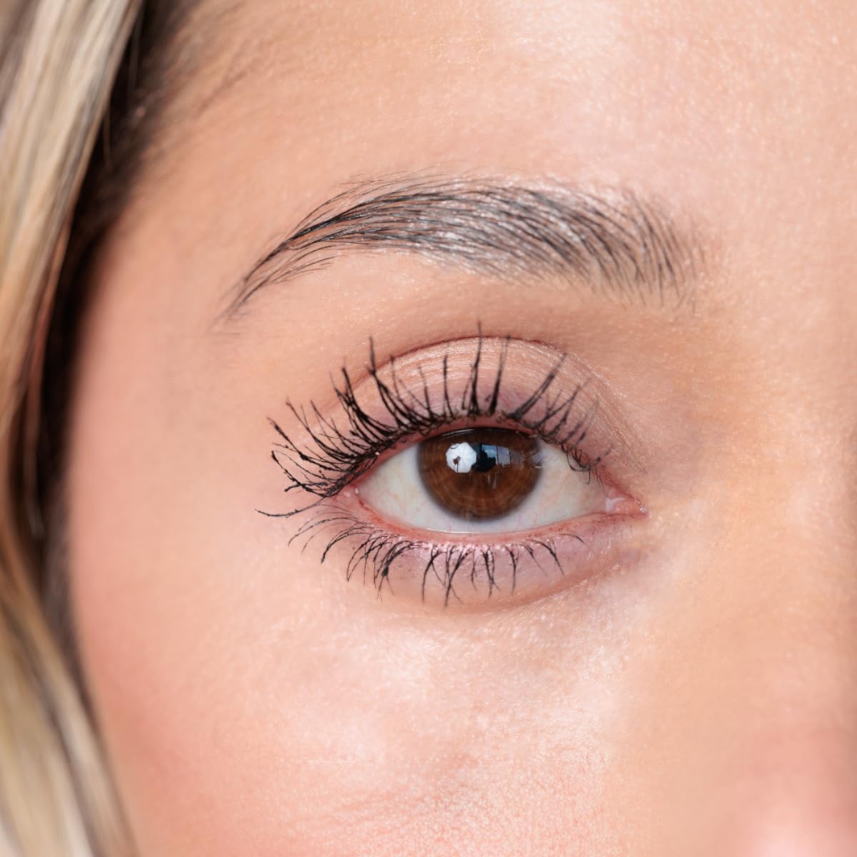 YuYa mascara next to ruler showing compact travel-friendly size
