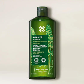 Yves Rocher shampoo in shower being applied to scalp for strengthening
