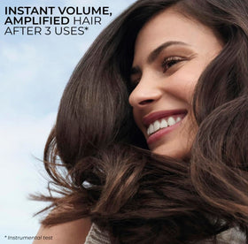 Yves Rocher shampoo in hand during application illustrating gentle lather and root lift benefit