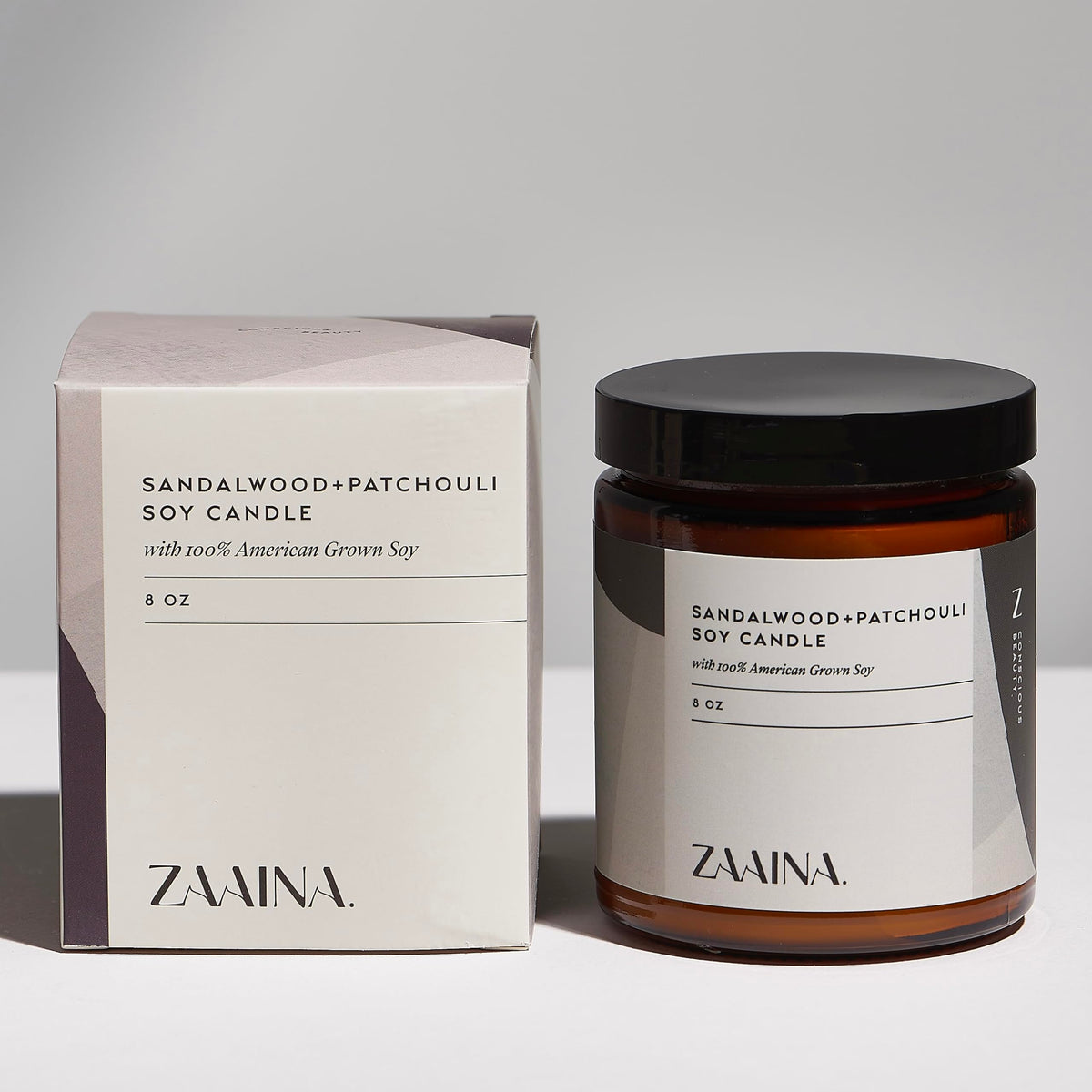 ZAAINA sandalwood candle lit to create a calming atmosphere and stress-relief benefit