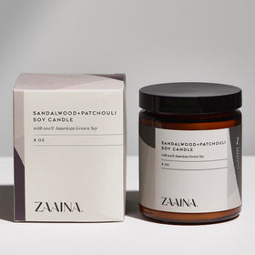 ZAAINA sandalwood candle lit to create a calming atmosphere and stress-relief benefit