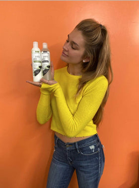 zatik set on bathroom shelf in lifestyle shot promoting daily use