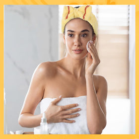 Zeyune headband worn during face-washing routine keeping hair back for clearer skincare