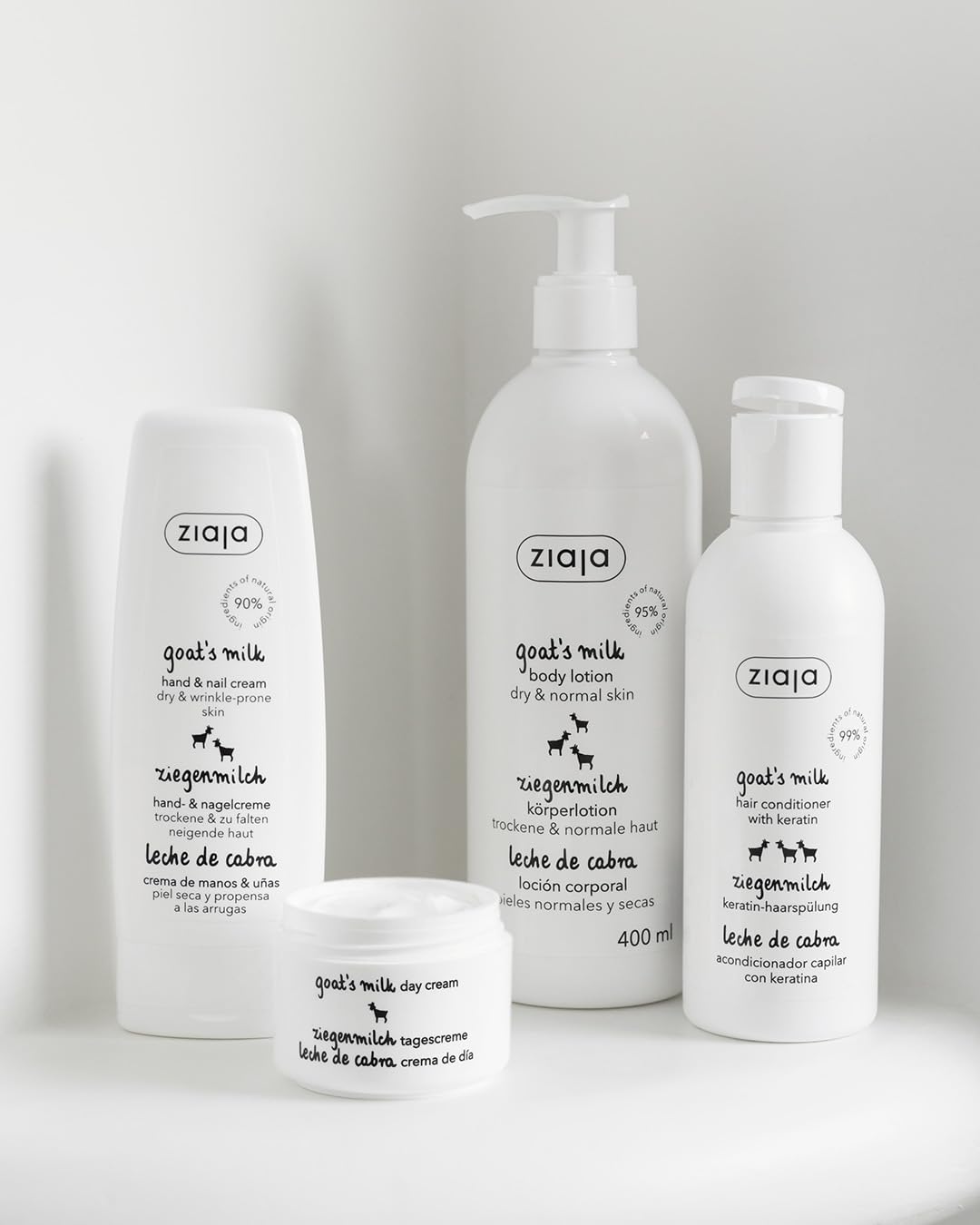 Person applying Ziaja goat's milk lotion to leg demonstrating fast absorption and softness