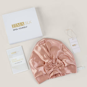 ZIMASILK care label and hand-stitched seam showing durability and easy maintenance