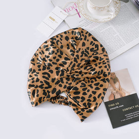 ZIMASILK bonnet in lounge setting suggesting stylish comfort and relaxation