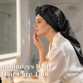 ZIMASILK bonnet held in hand to show extra length and scale for long styles