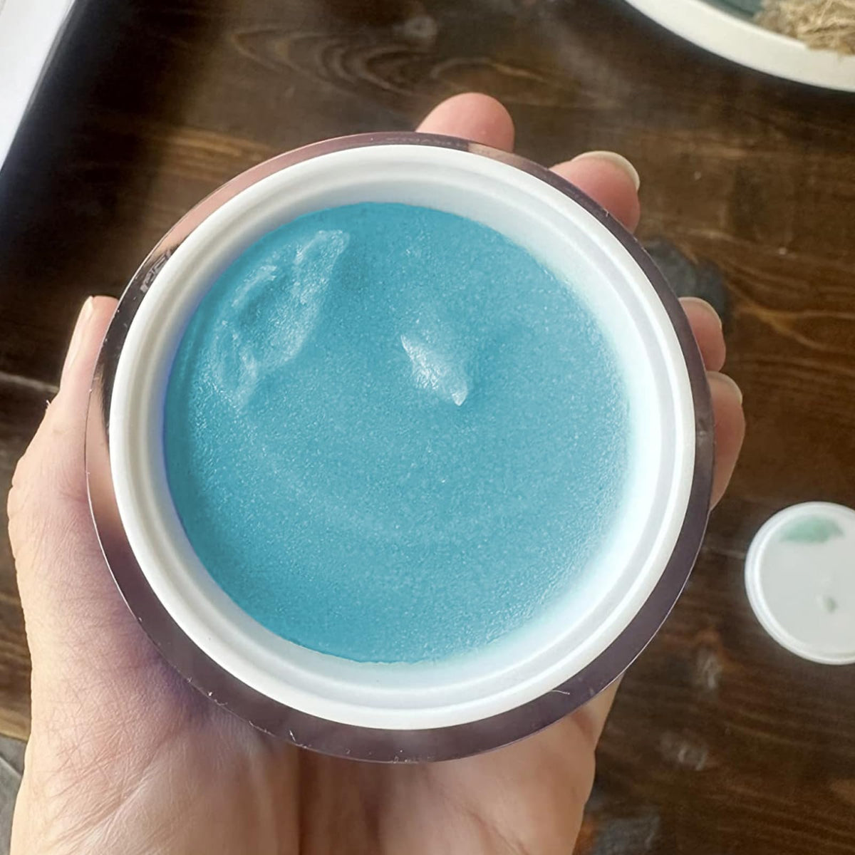 Zo-SKIN HEALTH product in hand demonstrating polish application and smooth finish benefit